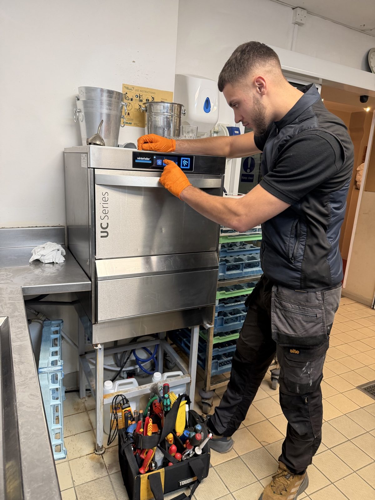 Our technician testing a Winterhalter UC Series undercounter dishwasher